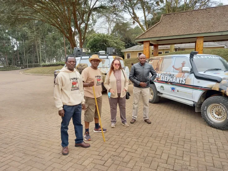 Foundation members and supporters gathered beside a Walk for Elephants vehicle